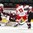 GRAND FORKS, NORTH DAKOTA - APRIL 24: Denmark gets the puck past during Latvia's Gustavs Grigals #29 for a first period goal while Roberts Kalkis #27, Denmark's Andreas Grundtvig #13, Latvia's Emils Ezitis #15, and Tomass Zeile #5 look on relegation round action at the 2016 IIHF Ice Hockey U18 World Championship. (Photo by Matt Zambonin/HHOF-IIHF Images)

